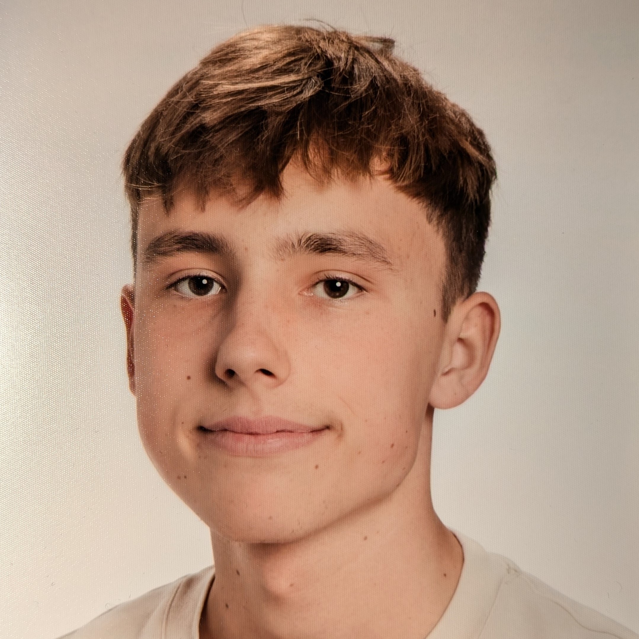 [headshot] image of satisfied student using a laptop